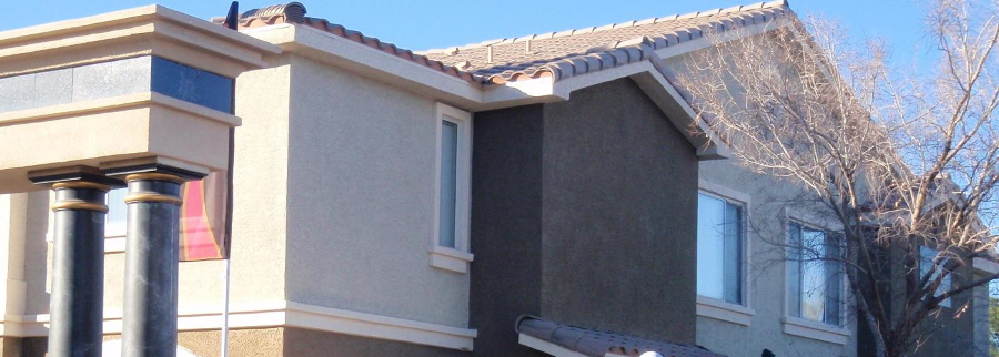 elderly couple posing with sky in the background